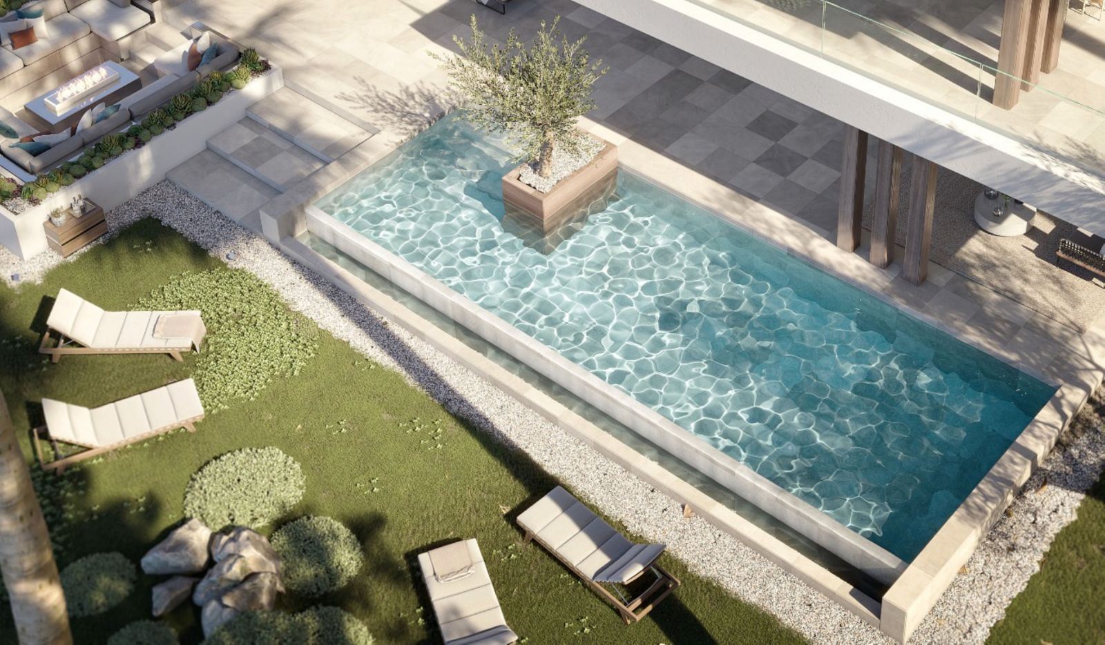Aerial view of a modern poolside patio with lounge chairs, greenery, and a pergola.